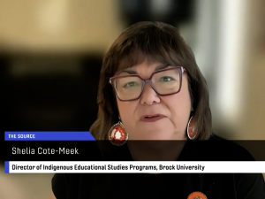 Director of Indigenous Educational Studies Programs Sheila Cote-Meek, wearing orange earrings and glasses, conducts a television interview with YourTV Niagara over Zoom.